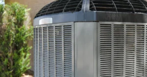 Outdoor AC condenser working through a Central Valley summer afternoon